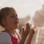 GIRL EATING COTTON CANDY 2500 x 1080