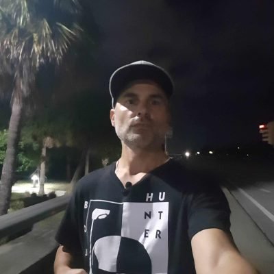 Ryan May walking near the U.S. 1 bridge in Jupiter, Florida at night.